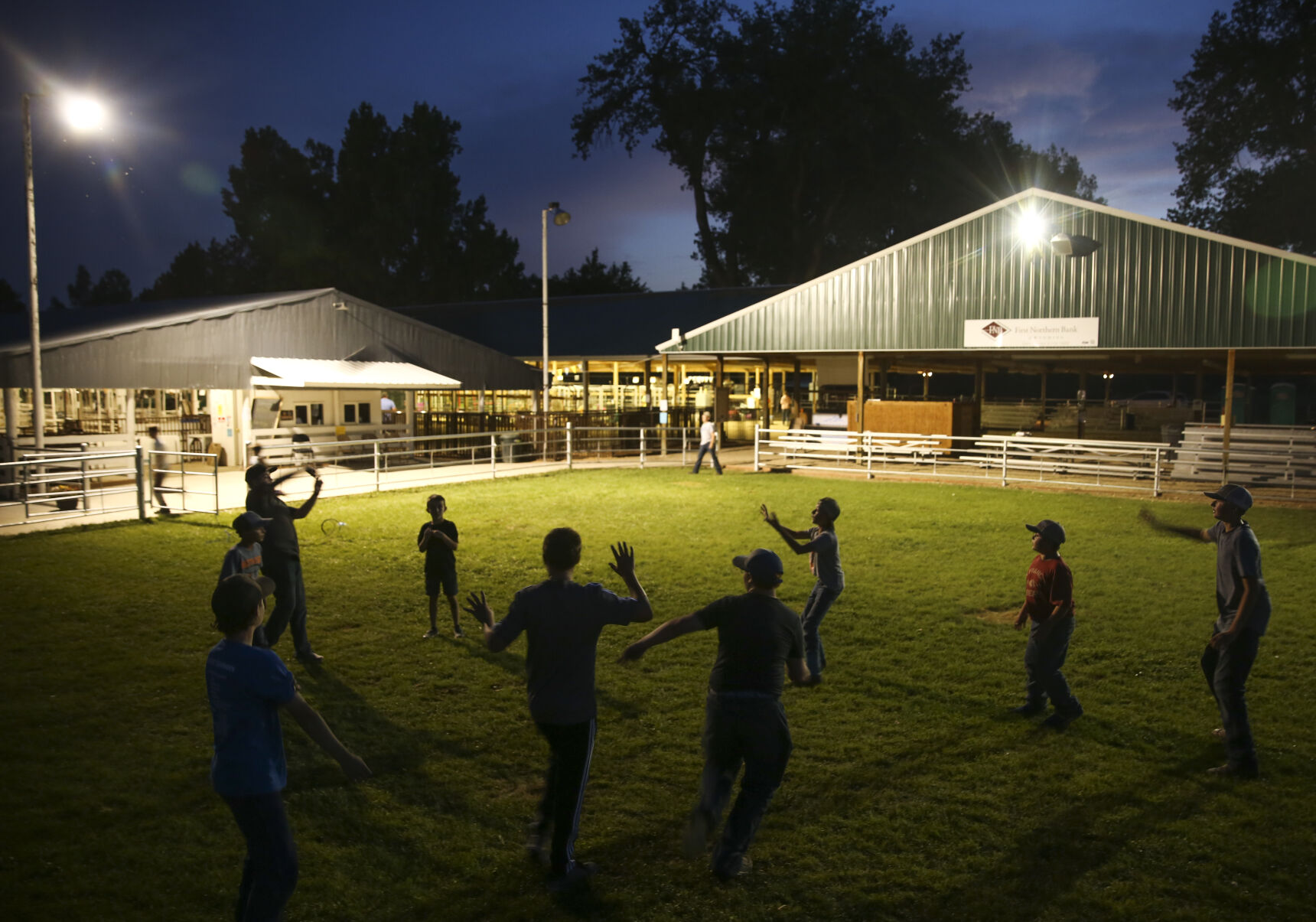 A group of boys kicked up a football game in the show pen